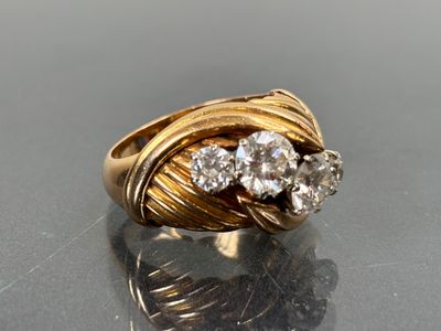 an image of a gold ring with two diamonds on top of it