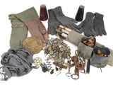 several pairs of gloves, gloves, and other items on a white surface