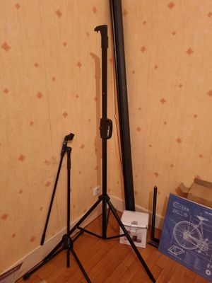 a picture of a camera and tripod stand in a room