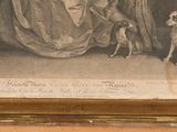 a picture of a woman and two dogs in front of a painting