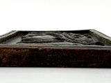 a small wooden box with a statue on it