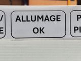 a close up of a sign on a shelf in a store