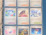 a lot of cards that are in a binder