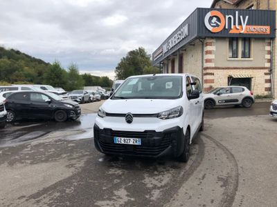 a white van that is parked in front of a building