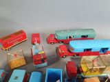 a lot of toy cars and trucks that are on the table