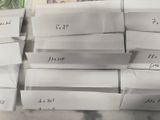 a pile of papers with notes on them on a table