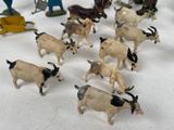 a lot of toy animals that are on a table