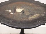a small table with a metal plate on it