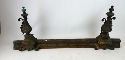 pair of antique cast iron candlesticks on wooden stand