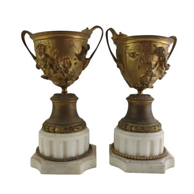 pair of antique vases on marble bases with gold decoration