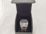 a watch in a black box on a white surface