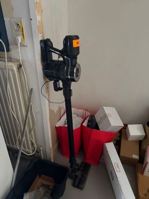 a camera that is sitting on a tripod in a room