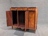 a small cabinet with a marble top and two doors open