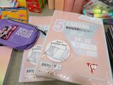 a lot of school supplies that are on the table