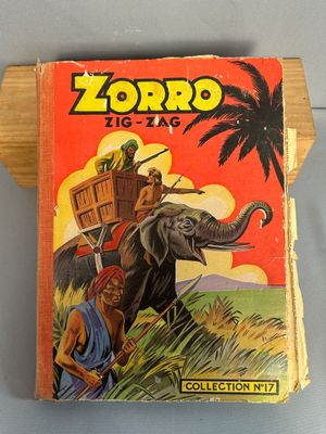 un vieux livre pour enfants avec l'image d'un homme chevauchant un éléphant