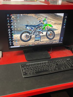 a computer on a desk with a keyboard and mouse