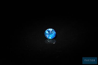 a blue diamond on a black background