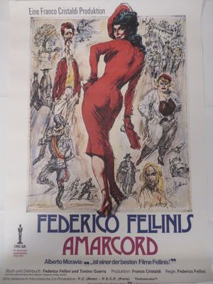 une affiche représentant une femme en robe rouge accrochée au mur