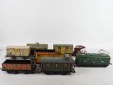 several toy trains are lined up in a row on a white surface