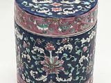 a blue and pink box with a floral design on it