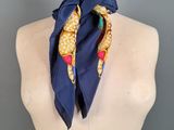a close up of a mannequin torso with a blue scarf on it