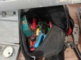 many tools in the tool bag on the table