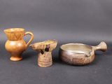 three different types of vases and bowls on the table