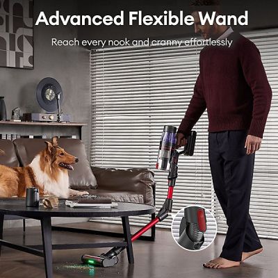 a man that is standing next to a dog with a vacuum