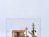 a clear box with a toy train set inside of it