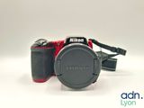 a camera that is sitting on a white surface