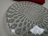 a glass box with a decorative design on top of it
