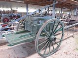 a green wagon that is sitting in a building