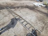 a man that is standing next to a ladder
