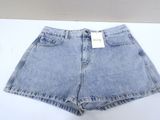 a close up of a pair of denim shorts on a white surface