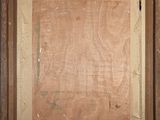 an old picture of a wooden frame with a painting on it
