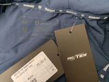 an image of a blue jacket with a price tag on it