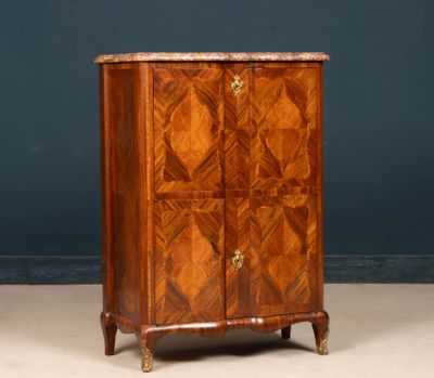 an antique wooden cabinet with a marble top and two doors