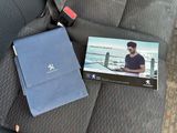 a picture of a book on the seat of a car