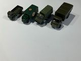 three toy trains sitting on a table next to each other