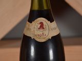 a bottle of wine that is sitting on a table