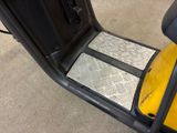 a close up view of a yellow golf cart with the door open