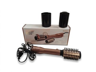 une image représentant un sèche-cheveux et une brosse à cheveux dans une boîte