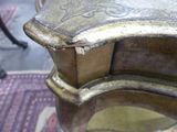 a close up of a metal object on a rug