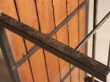 a close up of a metal gate with bars on it