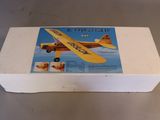 a box with a model of a small plane in it