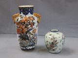 two vases sitting next to each other on a table
