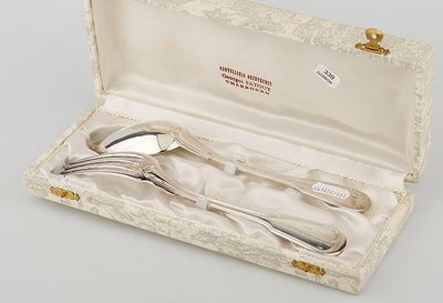 a silverware set in a box on a table