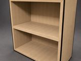 a close up of a wooden shelf with two shelves on each side