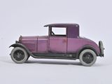 a purple toy car that is sitting on a white surface