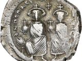 une pièce de monnaie en argent portant l'image d'un homme et d'une femme